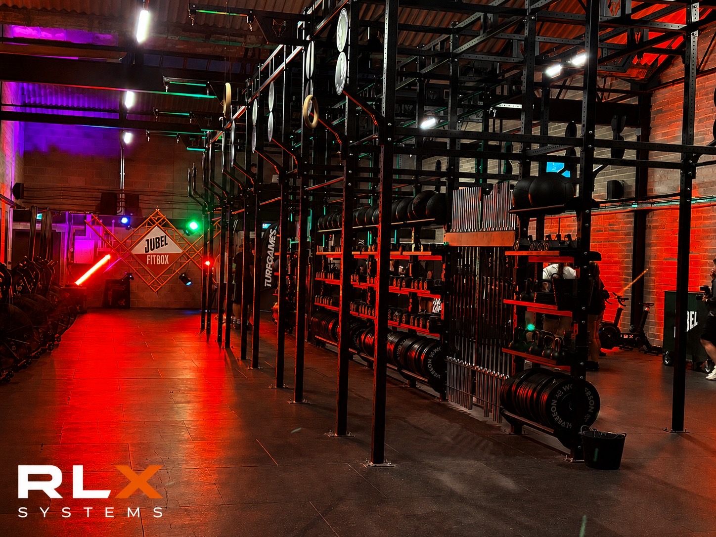 Lit training floor with coloured wash lighting at a fitness event